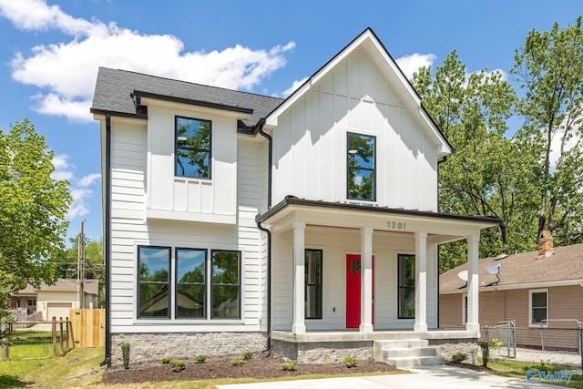 1201 Halsey Ave, Huntsville, AL 35801 - modern inspired farmhouse with a porch, board and batten siding, fence, and roof with shingles