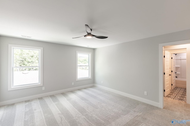 1201 Halsey Ave, Huntsville, AL 35801 - spare room with ceiling fan, light carpet, and baseboards