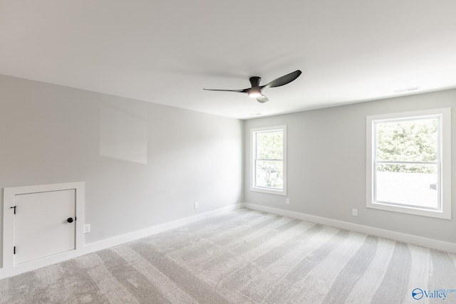 1201 Halsey Ave, Huntsville, AL 35801 - spare room featuring ceiling fan, baseboards, and light carpet