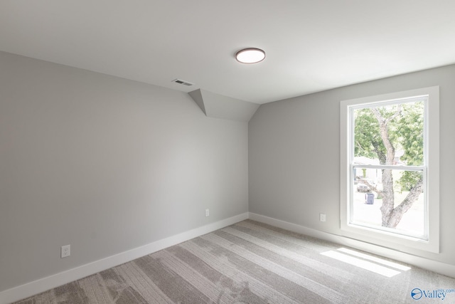 1201 Halsey Ave, Huntsville, AL 35801 - additional living space featuring vaulted ceiling, light colored carpet, and baseboards