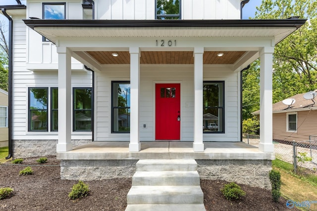 1201 Halsey Ave, Huntsville, AL 35801 - entrance to property featuring a porch, board and batten siding, and fence