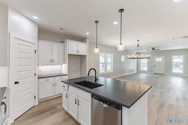 1201 Halsey Ave, Huntsville, AL 35801 - kitchen featuring stainless steel dishwasher, dark countertops, a sink, light wood-style floors, and recessed lighting