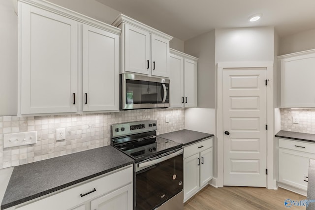 1201 Halsey Ave, Huntsville, AL 35801 - kitchen with stainless steel appliances, dark countertops, and tasteful backsplash