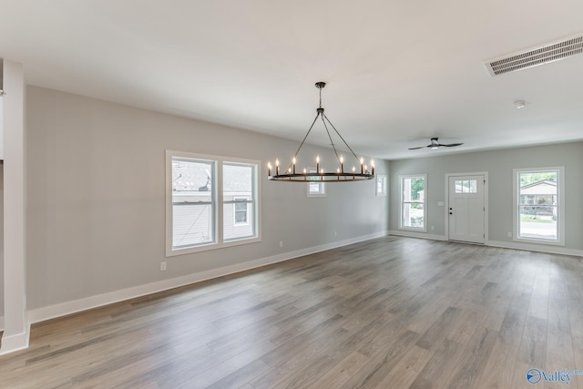 1201 Halsey Ave, Huntsville, AL 35801 - unfurnished dining area with a chandelier, wood finished floors, baseboards, and ceiling fan