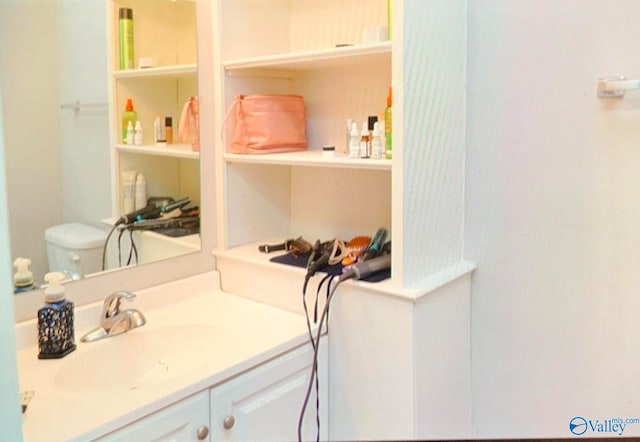 bathroom with vanity and toilet