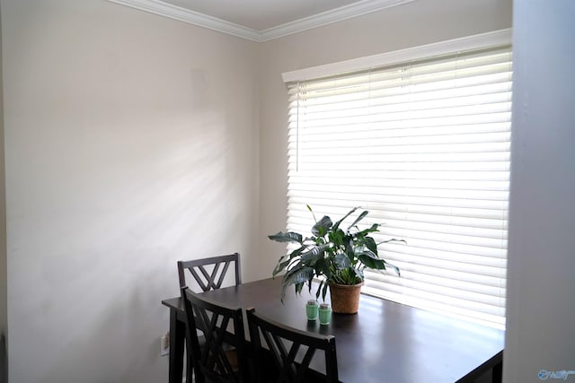 dining room featuring ornamental molding