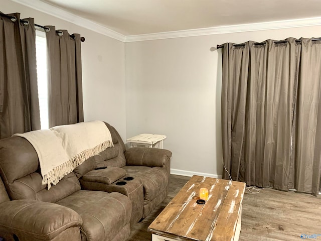 living room with wood-type flooring and crown molding