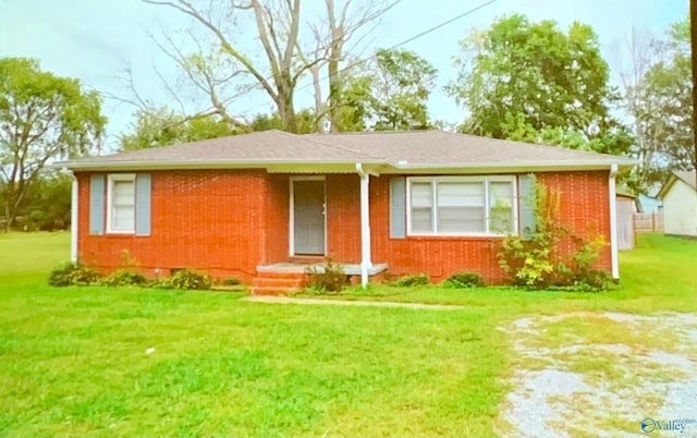 ranch-style home with a front lawn