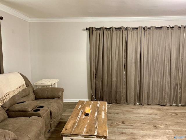 living room featuring light hardwood / wood-style flooring and ornamental molding