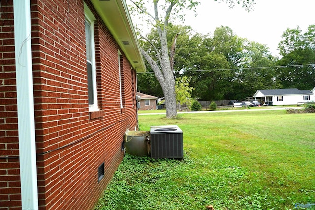 view of yard featuring central AC unit