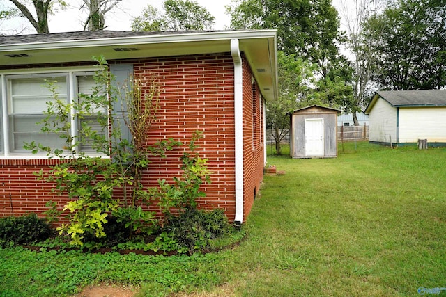 view of home's exterior with a storage shed and a lawn