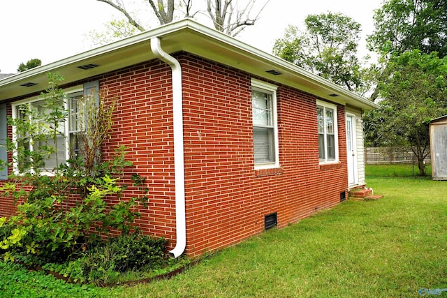 view of side of property with a lawn