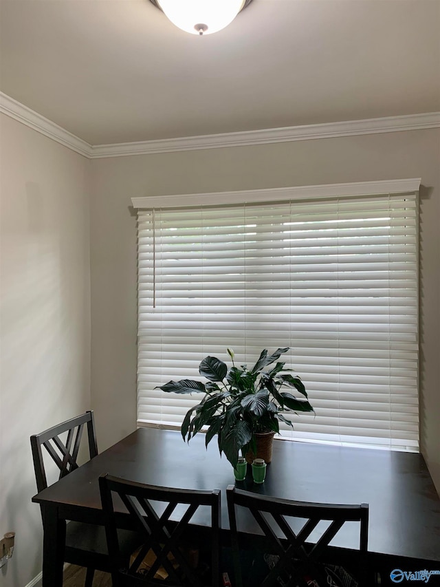 dining area featuring ornamental molding