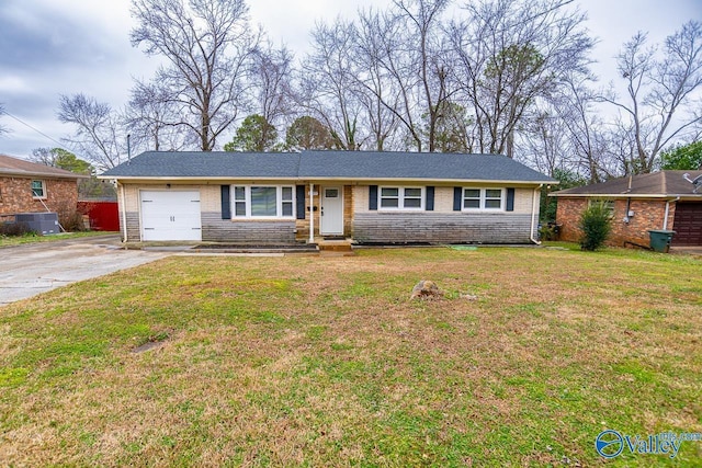 single story home with a garage and a front yard