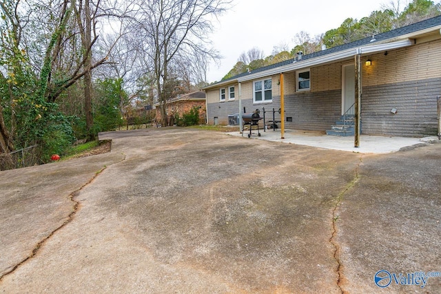 back of property featuring a patio area