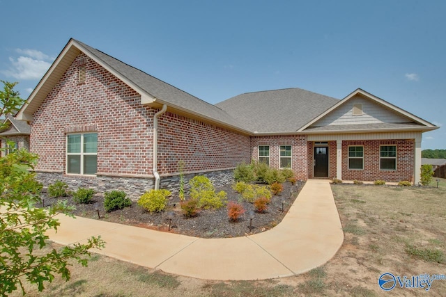 view of front of home featuring brick siding