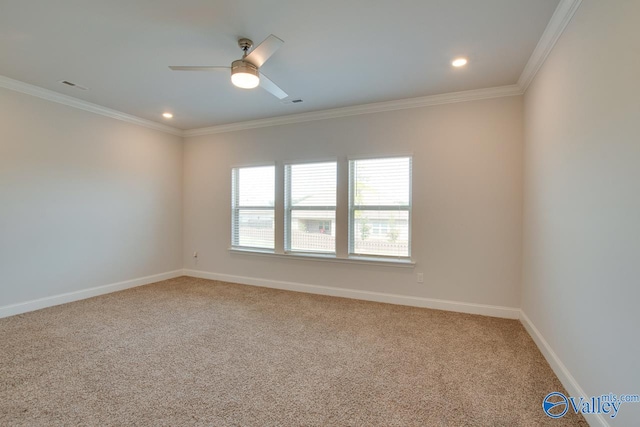 spare room featuring ornamental molding, ceiling fan, and carpet flooring