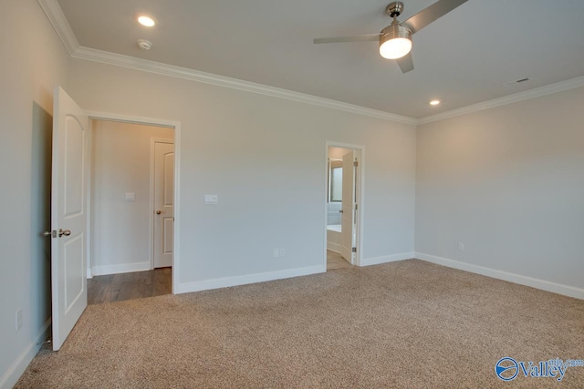 unfurnished bedroom with carpet flooring, ceiling fan, connected bathroom, and ornamental molding