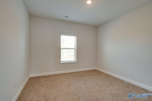 unfurnished room with carpet flooring