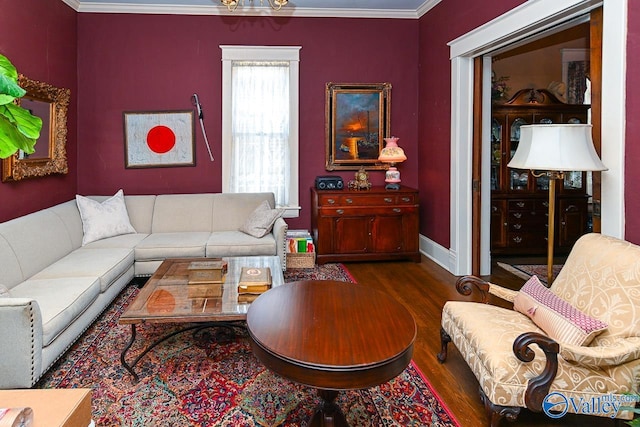 living room with crown molding, wood finished floors, and baseboards