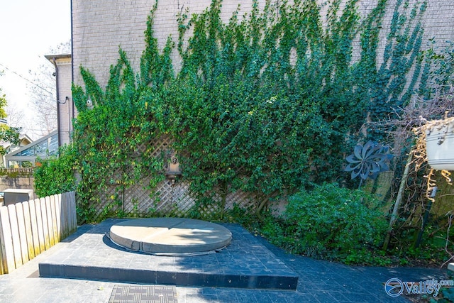 view of patio / terrace featuring fence