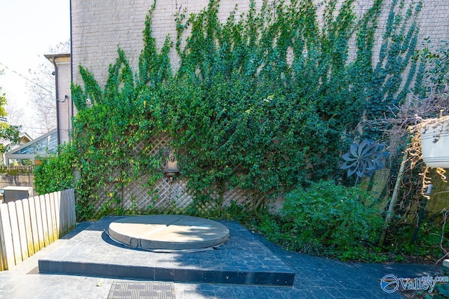 view of patio featuring fence