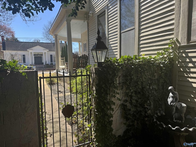 view of home's exterior with fence