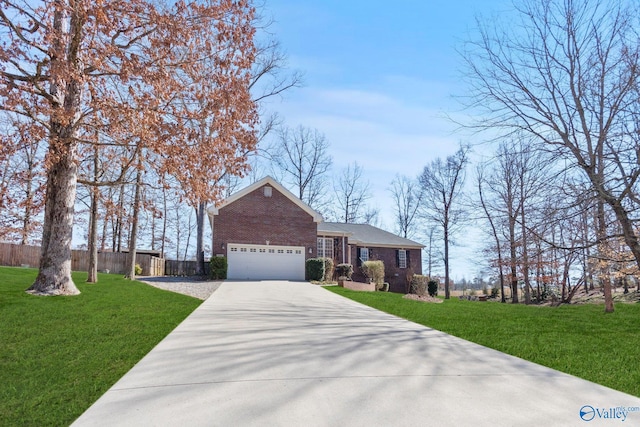 view of front of home with concrete driveway, brick siding, a front lawn, and an attached garage