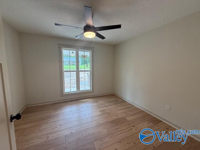 6255 Vista Trl, Southside, AL 35907 - spare room featuring ceiling fan, light wood finished floors, and baseboards