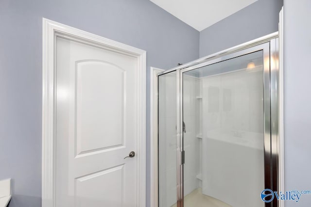 bathroom featuring a shower stall