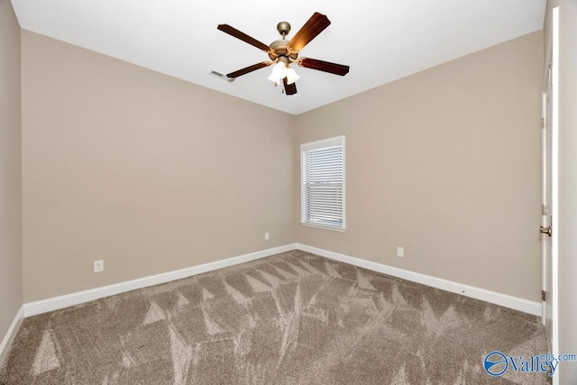 carpeted empty room featuring visible vents, baseboards, and ceiling fan
