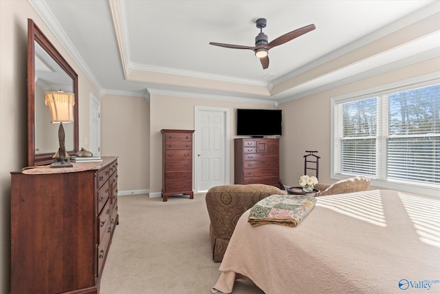 bedroom with baseboards, a raised ceiling, crown molding, and light colored carpet