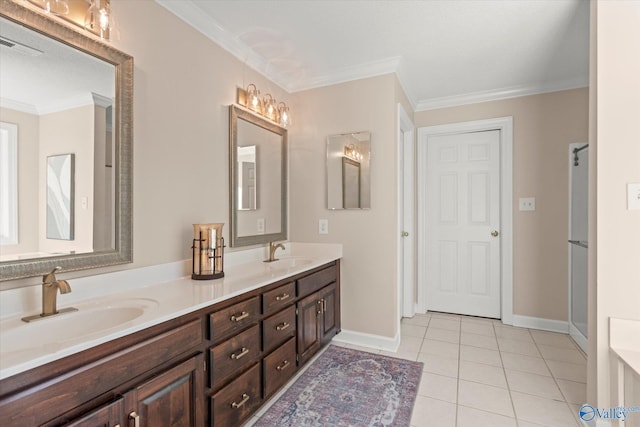 bathroom featuring crown molding, double vanity, a sink, and tile patterned floors