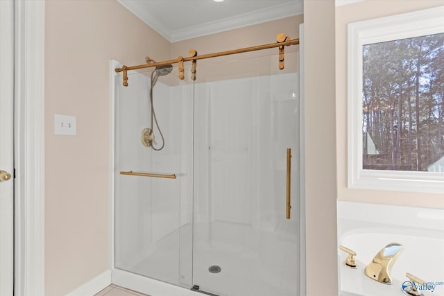 bathroom featuring a bath, a stall shower, baseboards, and crown molding