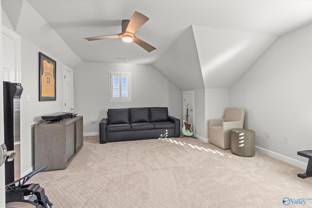 living area featuring a ceiling fan, lofted ceiling, light carpet, and baseboards