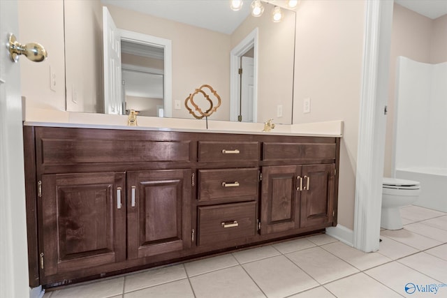 full bathroom with toilet, double vanity,  shower combination, and tile patterned floors