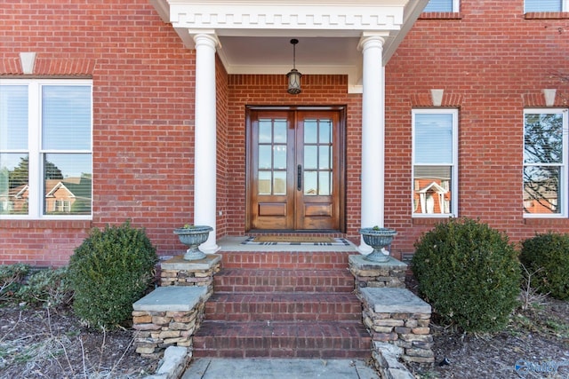 entrance to property with french doors and brick siding