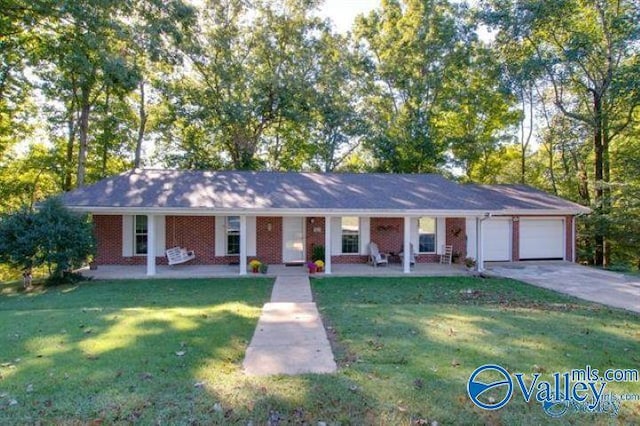 ranch-style house with a front yard, an attached garage, covered porch, and concrete driveway