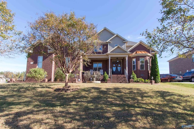 craftsman house with a front lawn