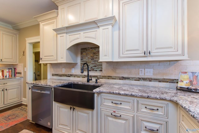 kitchen with stainless steel dishwasher, sink, light stone counters, and dark hardwood / wood-style floors