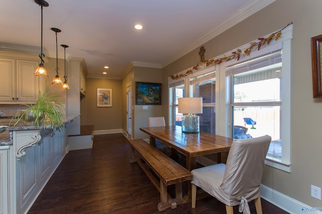 dining space featuring dark hardwood / wood-style floors and crown molding