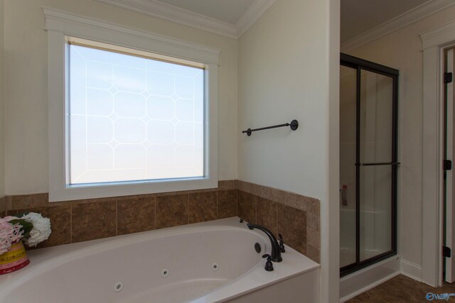 bathroom with a healthy amount of sunlight, shower with separate bathtub, and ornamental molding