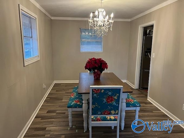 dining space with a chandelier, dark hardwood / wood-style floors, and ornamental molding