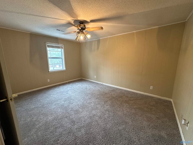 carpeted spare room with ceiling fan and a textured ceiling