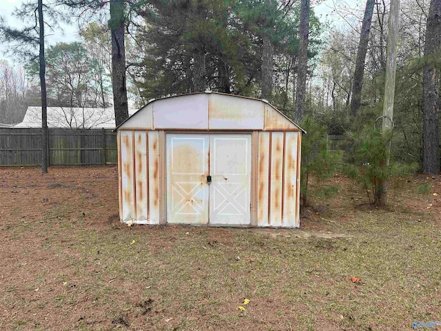view of outdoor structure with a lawn