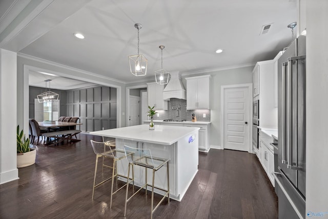 2654 Mountain Stream Way, Owens Cross Roads, AL 35763 - kitchen featuring premium range hood, appliances with stainless steel finishes, light countertops, crown molding, and white cabinets