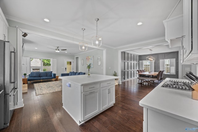 2654 Mountain Stream Way, Owens Cross Roads, AL 35763 - kitchen with stainless steel appliances, crown molding, white cabinetry, ceiling fan, and light countertops