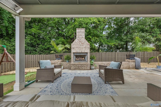2654 Mountain Stream Way, Owens Cross Roads, AL 35763 - fenced backyard with a patio area and an outdoor living space with a fireplace