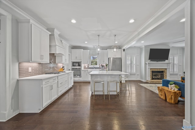 2654 Mountain Stream Way, Owens Cross Roads, AL 35763 - kitchen with stainless steel appliances, a brick fireplace, open floor plan, tasteful backsplash, and crown molding
