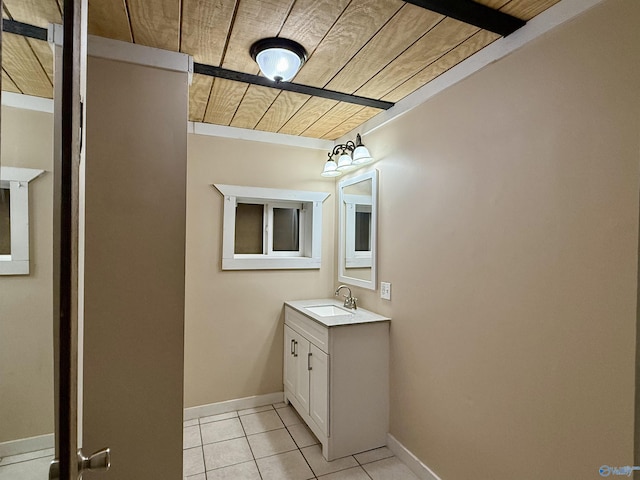 bathroom featuring tile patterned flooring, baseboards, wooden ceiling, and vanity